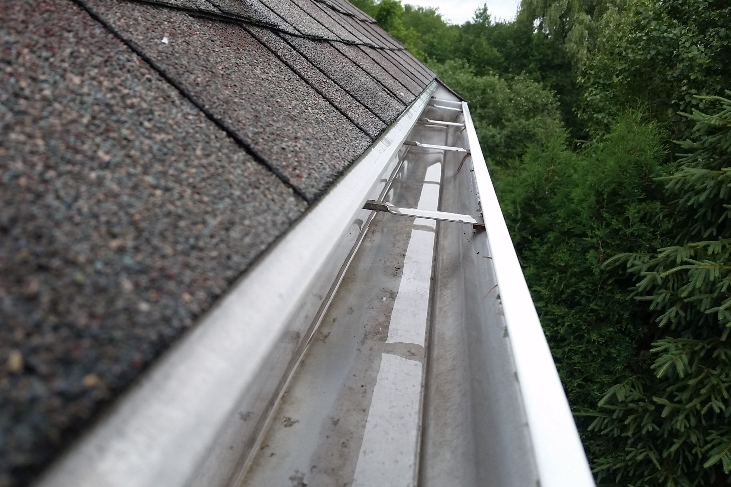 Professionally cleaned gutters on 2 story roof by So Cal Cleaning Services in San Diego, CA